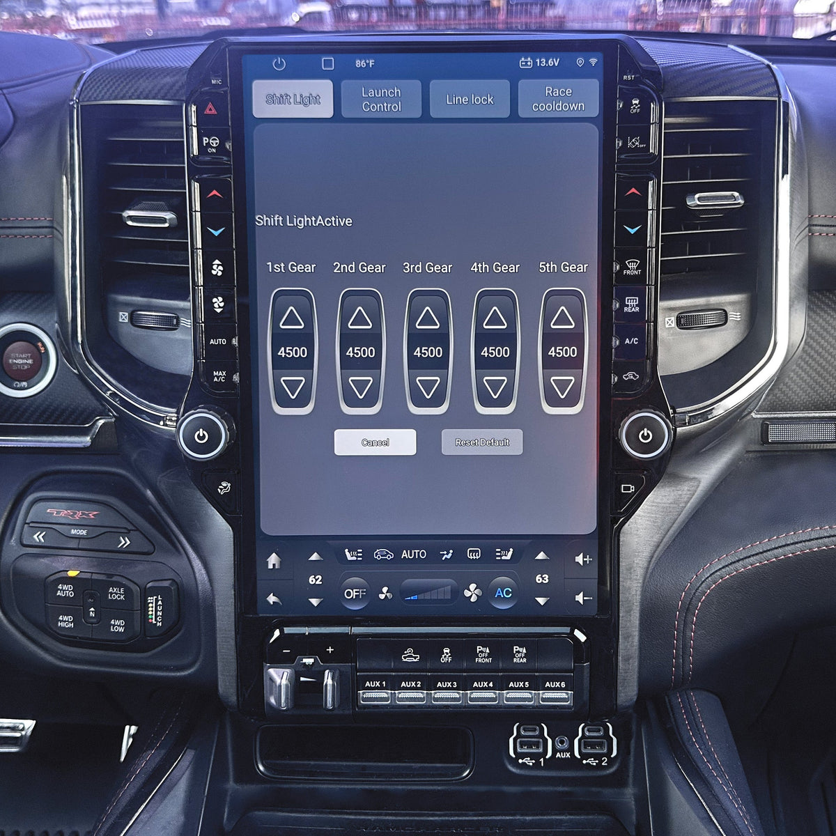 Car interior with a large touchscreen display on the dashboard.