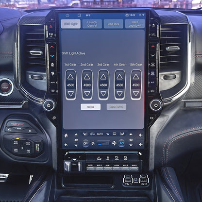 Car interior with a large touchscreen display on the dashboard.