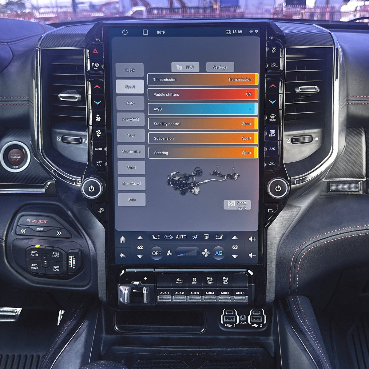 Car interior with a large touchscreen display in the center console.