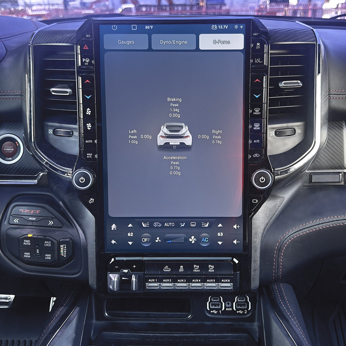 Car interior with a large touchscreen display in the center console.