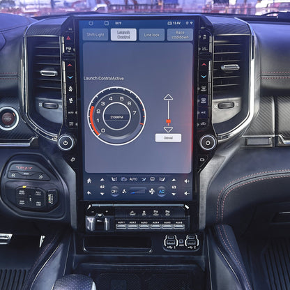 Car interior with a large touchscreen display on the dashboard.