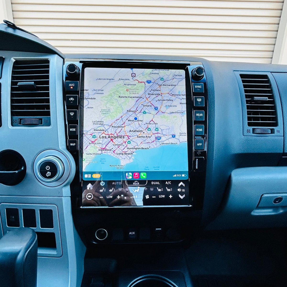 Car dashboard with a navigation screen displaying a map.